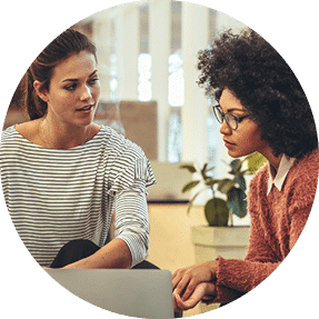 Two professional women working together at their workplace