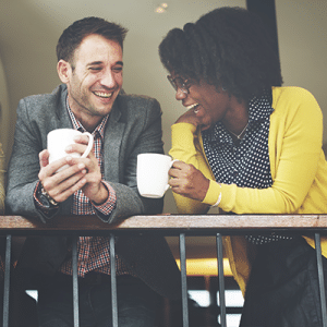 Colleagues chatting over coffee