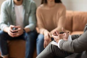 Couple talking at session with therapist