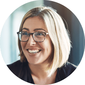 Professional woman wearing glasses and smiling