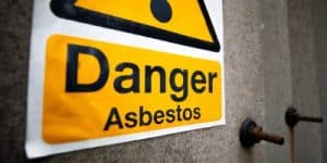 Absestos danger sign crime and regulatory